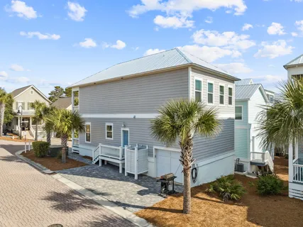 a view of a house with backyard and a barbeque