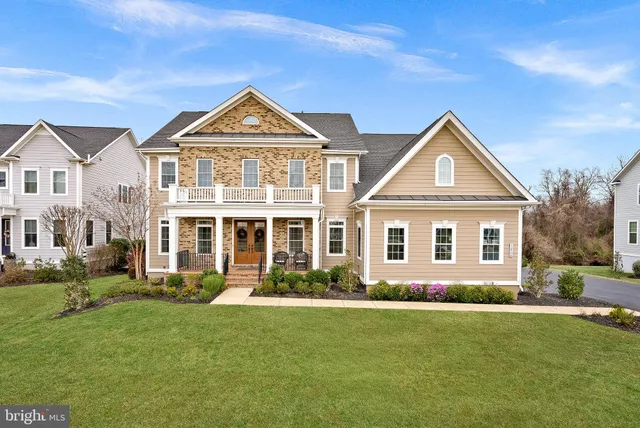 a view of entryway livingroom and hall with wooden floor