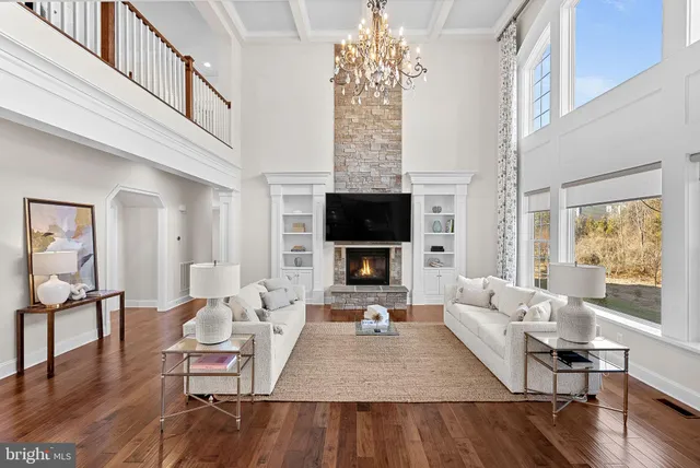 a bedroom with a bed and painting on the wall