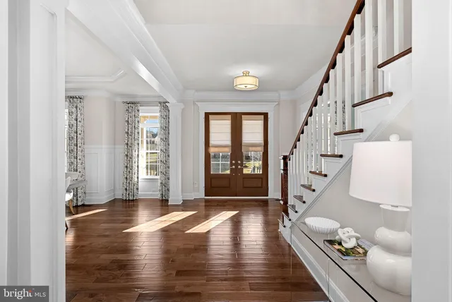 a view of a livingroom with furniture wooden floor and a view