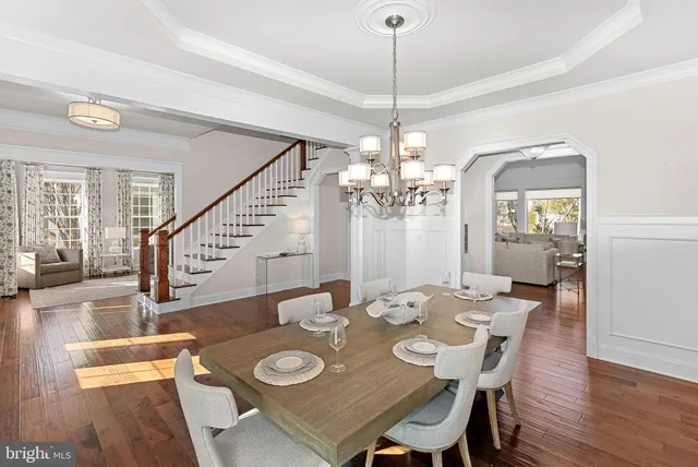 a kitchen with stainless steel appliances granite countertop a sink a stove and cabinets