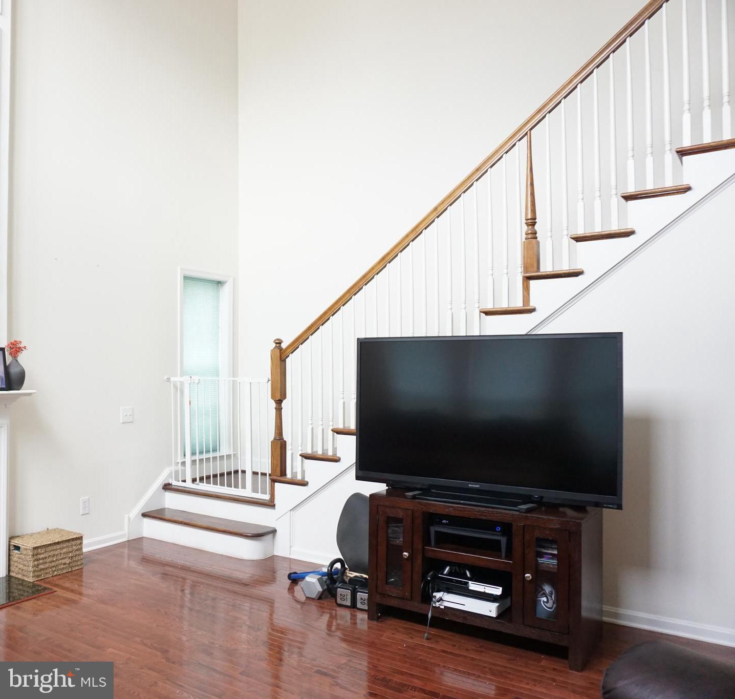 1403 Hampshire Lane Chester Springs, PA 19425 - Photo 11 of 31 a living room with furniture and a flat screen tv