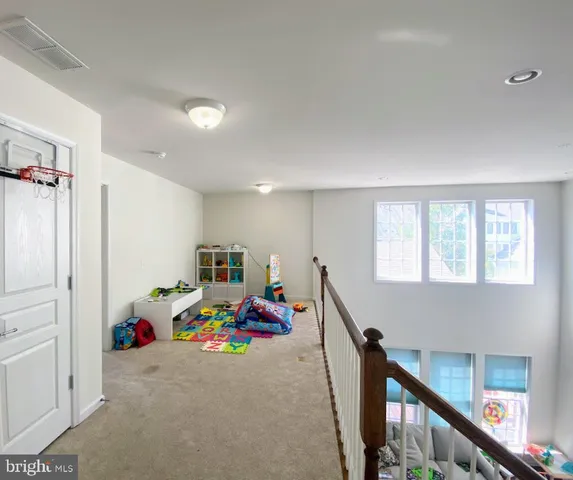 a children room with toys and a window