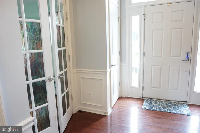 an empty room with wooden floor