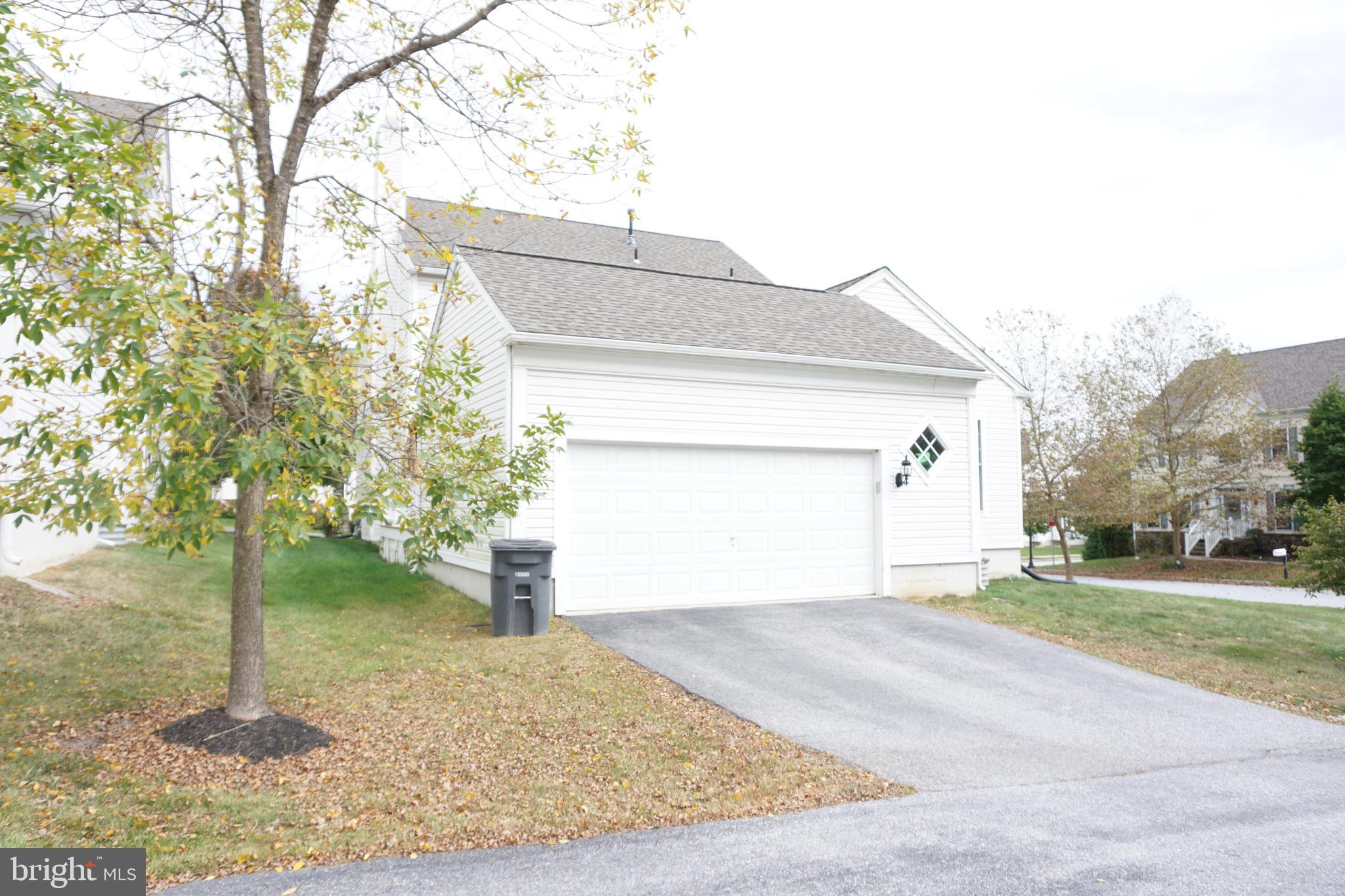 1403 Hampshire Lane Chester Springs, PA 19425 - Photo 25 of 31 a view of a house with a yard and garage