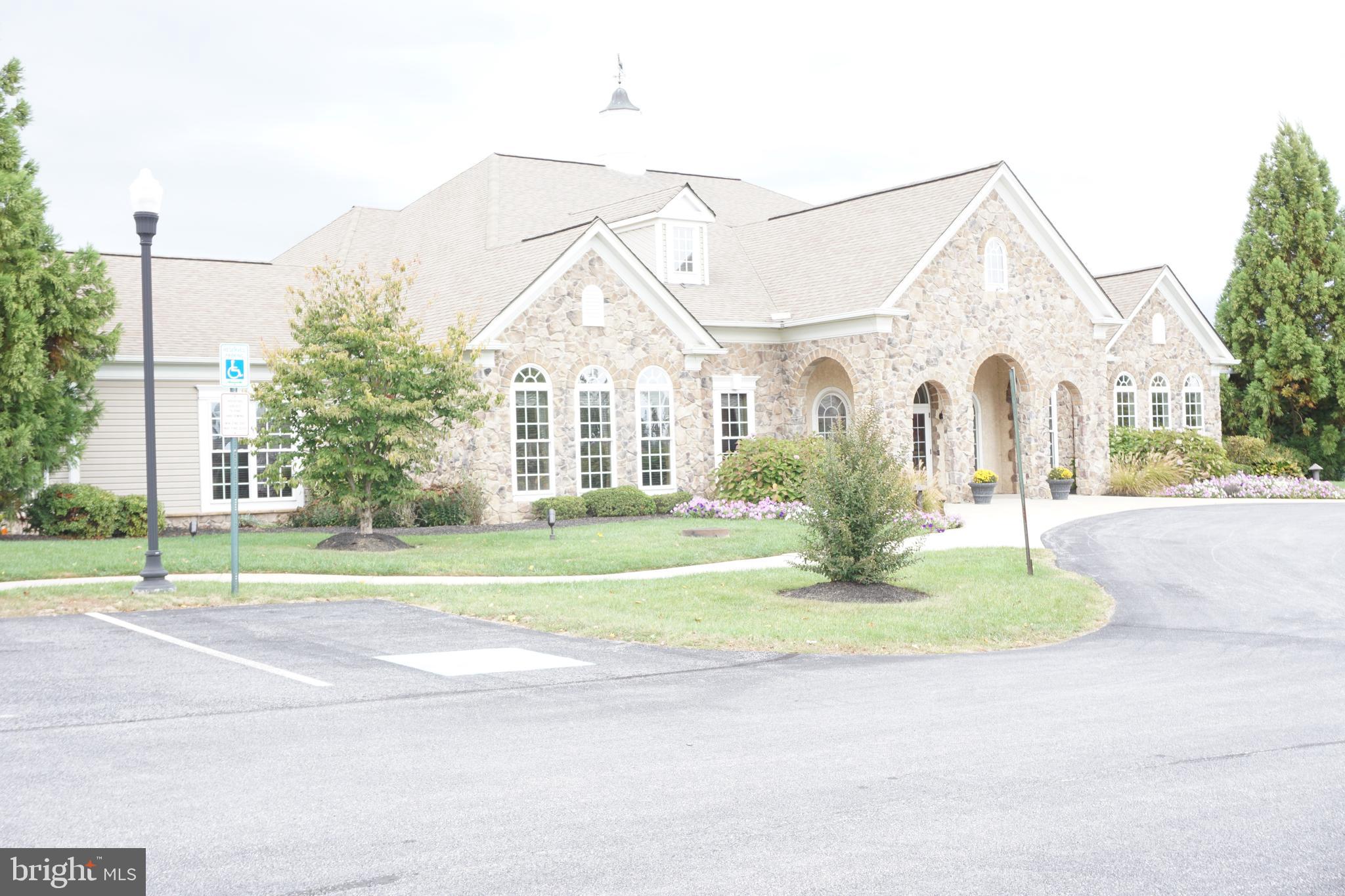 1403 Hampshire Lane Chester Springs, PA 19425 - Photo 29 of 31 a view of a house with a yard and table and chairs