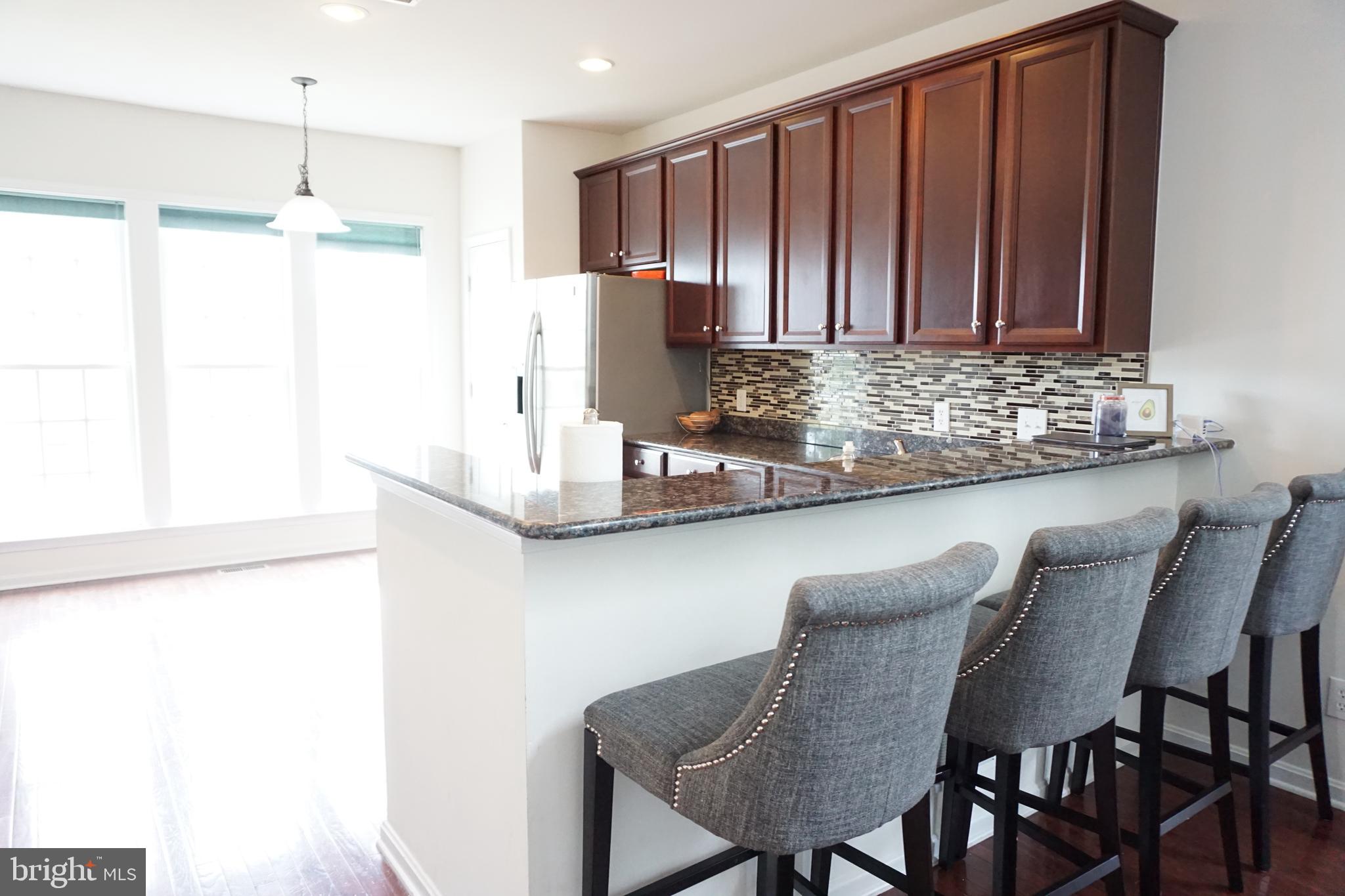 1403 Hampshire Lane Chester Springs, PA 19425 - Photo 7 of 31 a kitchen with a table and chairs in it