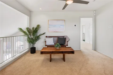 a bedroom with a bed and glass walk in closet