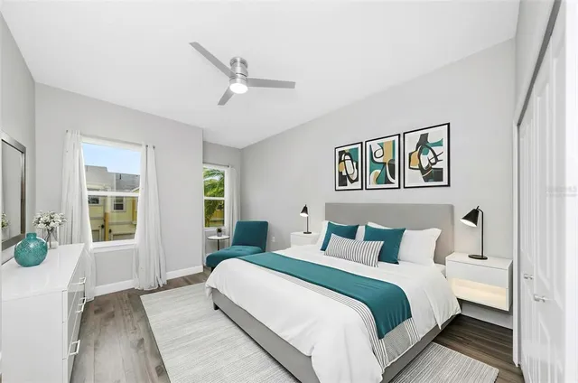 a bedroom with a large bed and a window