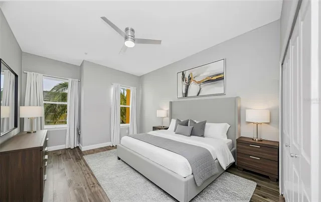 a bedroom with a large bed and a window