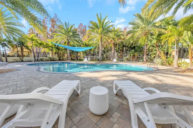 a kitchen with granite countertop a sink and a stove top oven