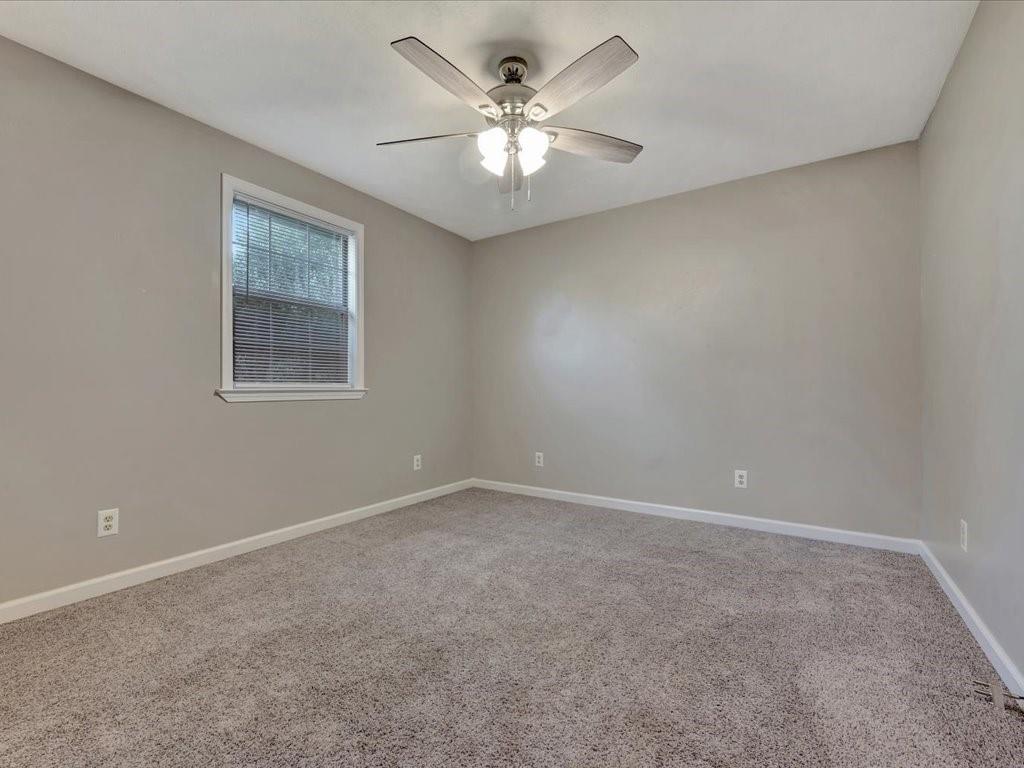 977 Farm To Market 347 Rusk, TX 75785 - Photo 22 of 33 a view of an empty room with a window