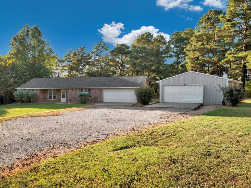 977 Farm To Market 347 Rusk, TX 75785 - Photo 4 of 33 a house view with a swimming pool