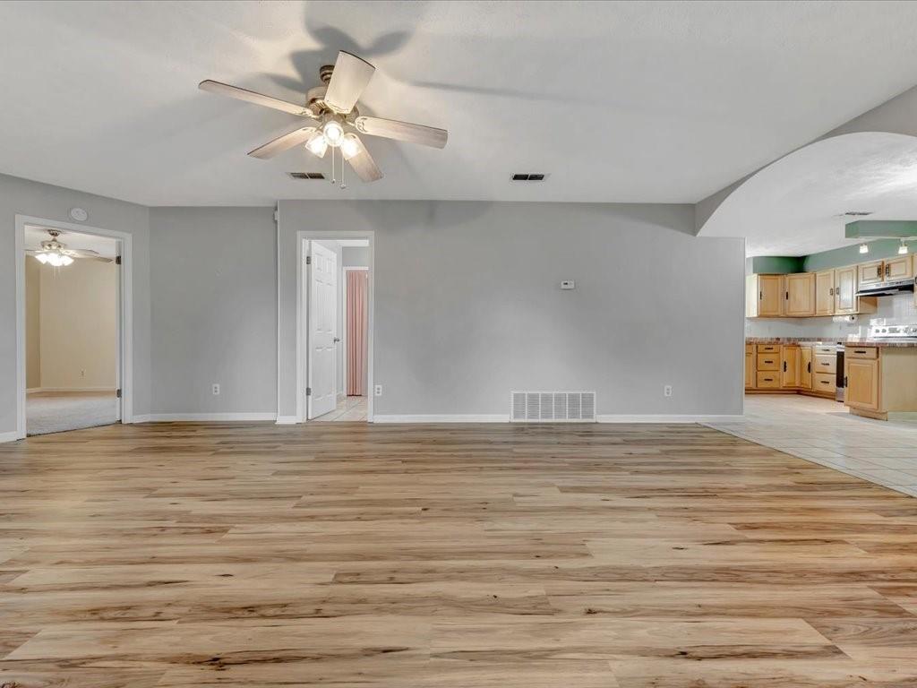 977 Farm To Market 347 Rusk, TX 75785 - Photo 7 of 33 a view of a livingroom with wooden floor and a ceiling fan