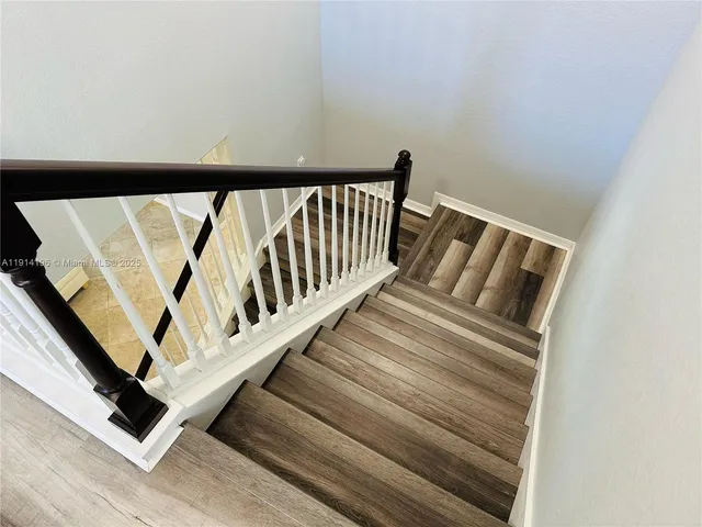 a view of a balcony with wooden floor