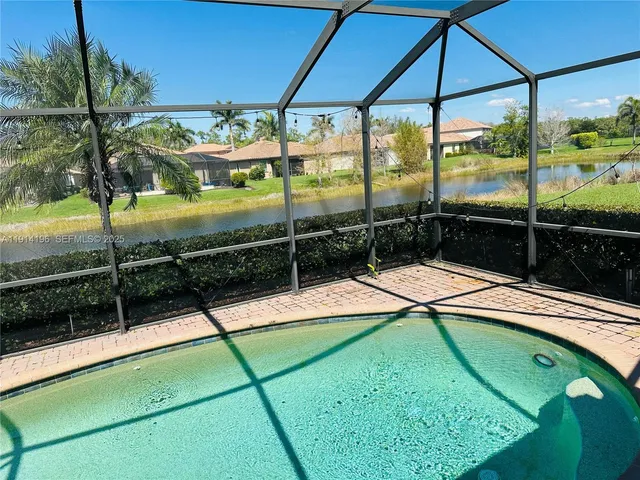 a view of a glass door with a yard