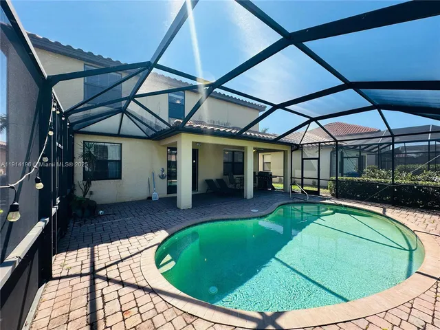 a view of a house with swimming pool