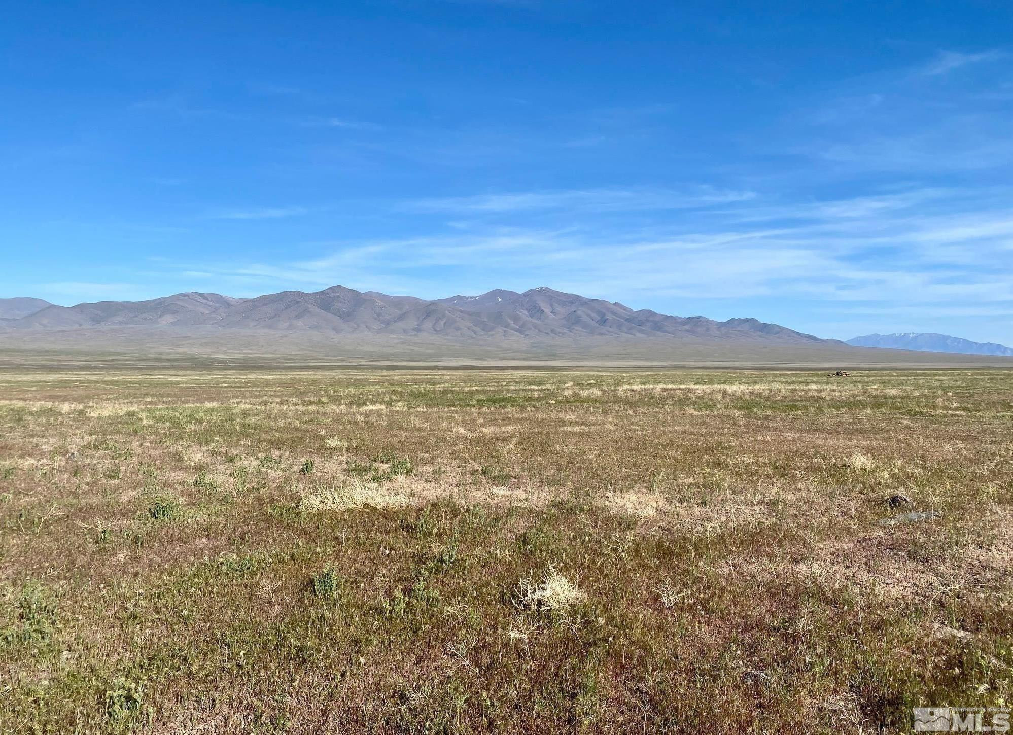a view of an ocean with a mountain