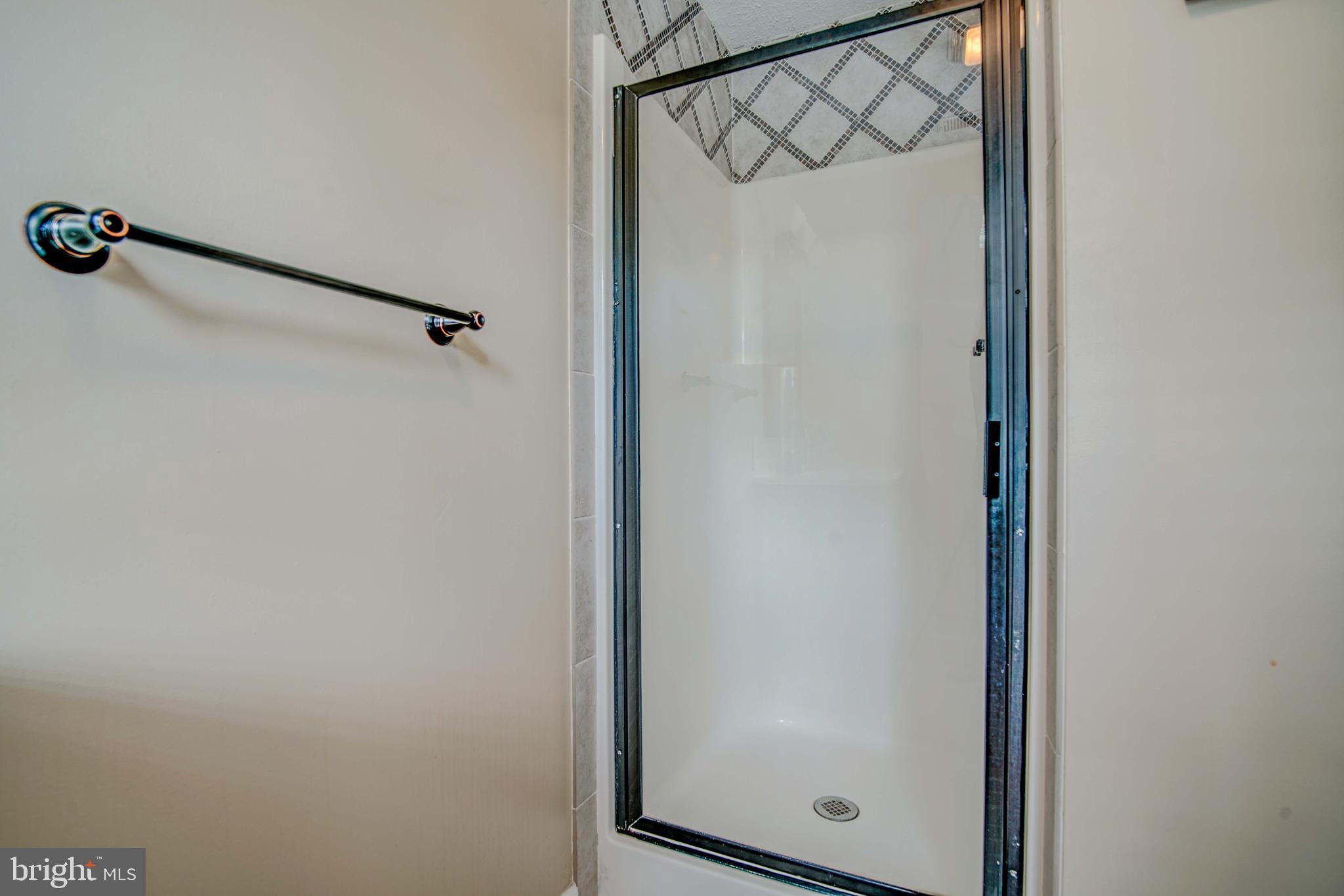 245 Newtown Road Solomons, MD 20688 - Photo 16 of 26 a bathroom with a shower