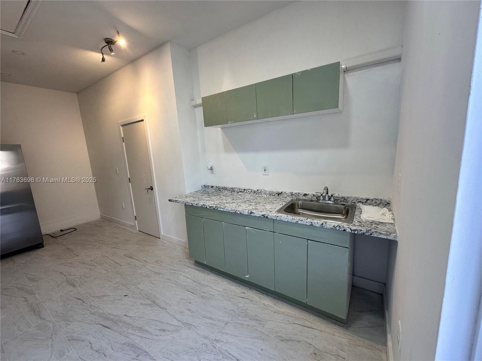 13137 Southwest 284th Street, Unit B Homestead, FL 33033 - Photo 8 of 11 a bathroom with a sink and a mirror