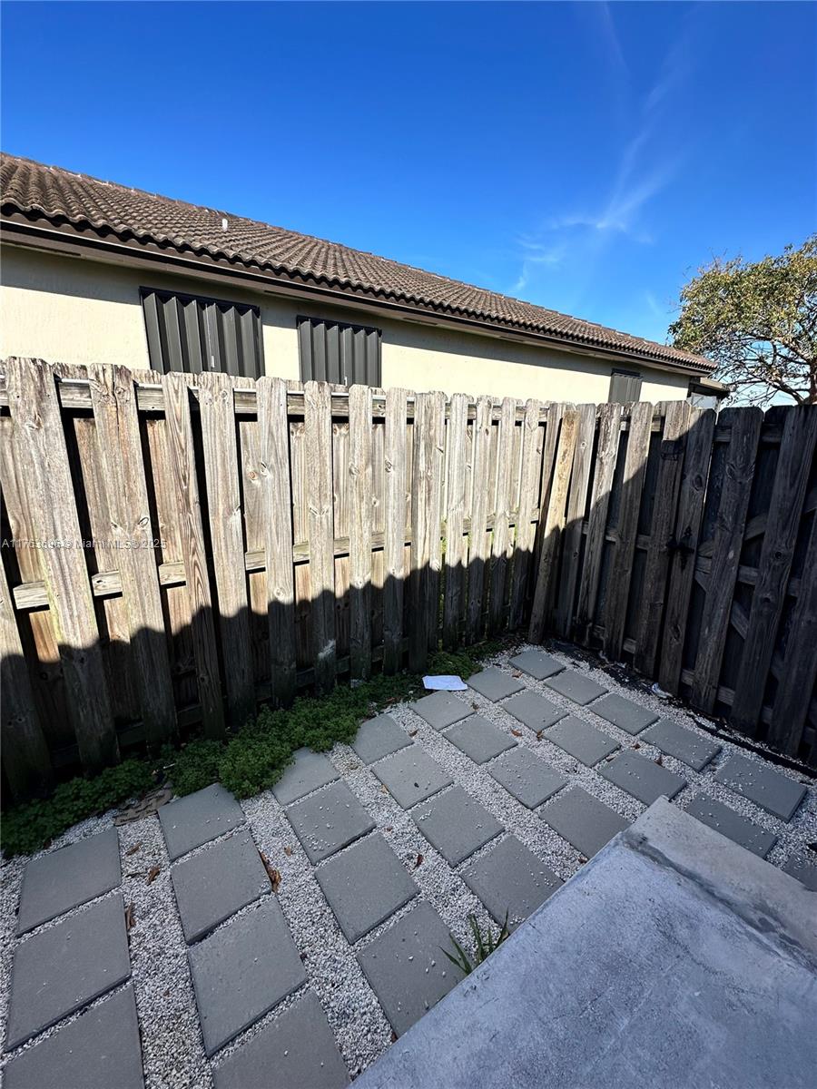 13137 Southwest 284th Street, Unit B Homestead, FL 33033 - Photo 10 of 11 a view of wooden fence