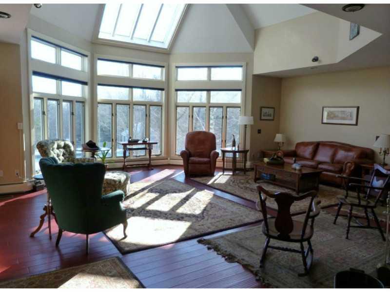 127 Kennard Road Newburgh, ME 04444 - Photo 8 of 32 Living Room. Light-filled and so...
