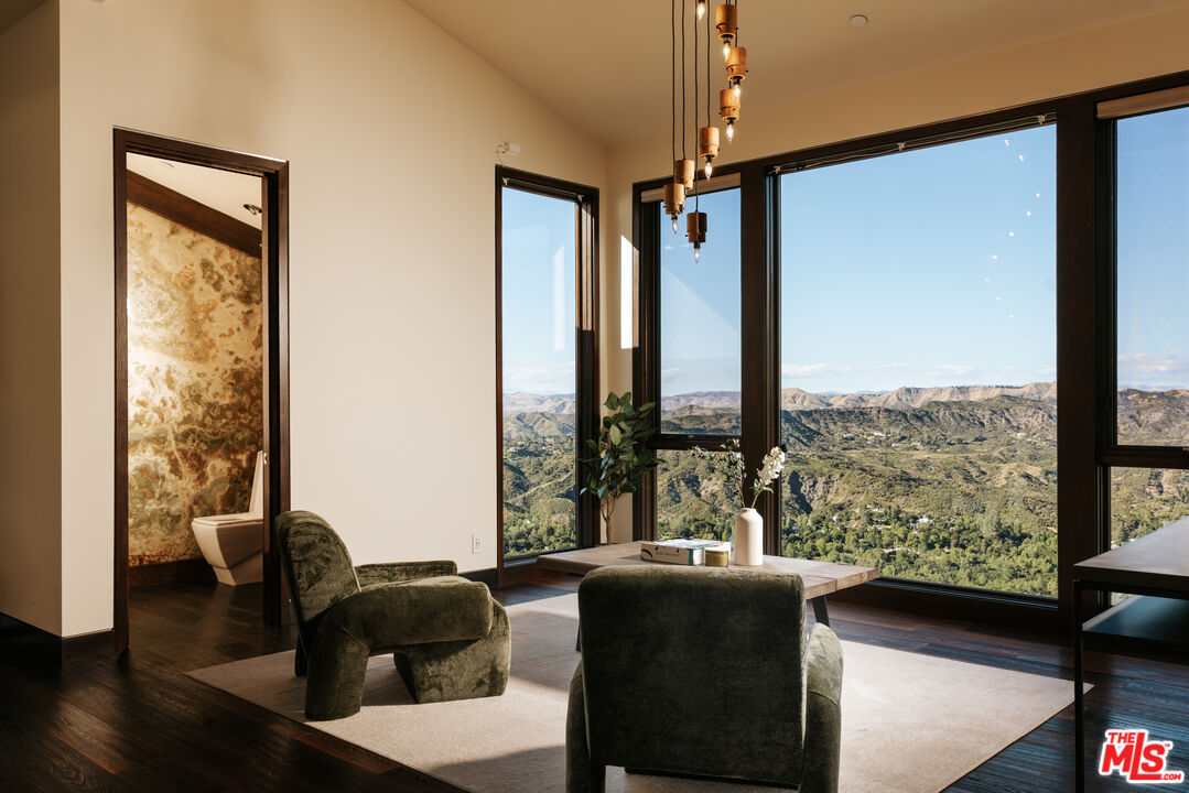 25155 Piuma Road Malibu, CA 90265 - Photo 13 of 23 a living room with furniture and a large window