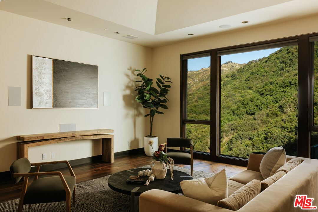25155 Piuma Road Malibu, CA 90265 - Photo 14 of 23 a living room with furniture and a large window