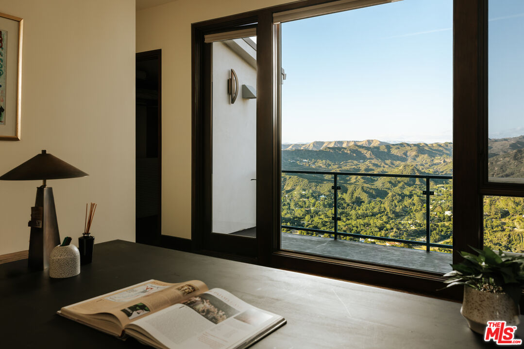 25155 Piuma Road Malibu, CA 90265 - Photo 16 of 23 a picture of a table and a potted plant
