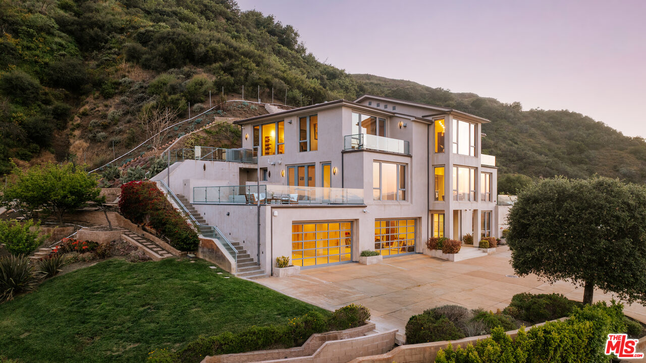 25155 Piuma Road Malibu, CA 90265 - Photo 2 of 23 a front view of a house with a yard