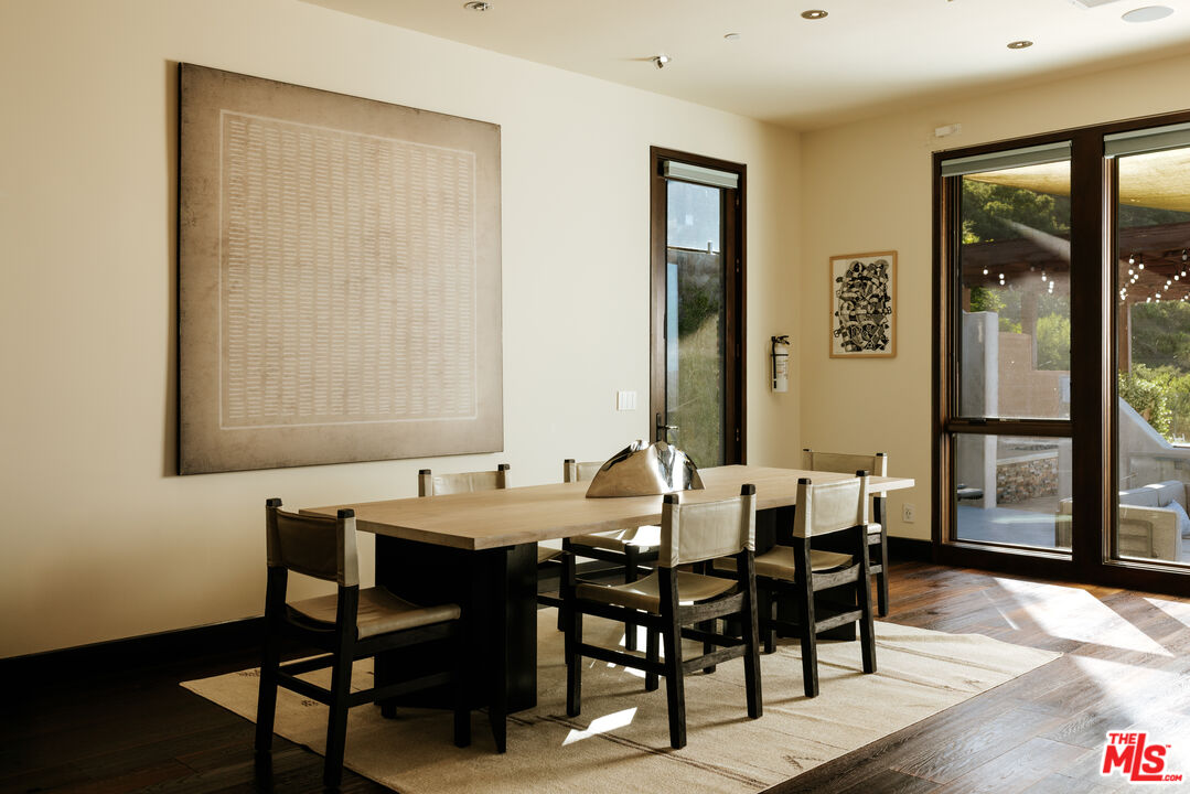 25155 Piuma Road Malibu, CA 90265 - Photo 5 of 23 a view of a dining room with furniture and wooden floor