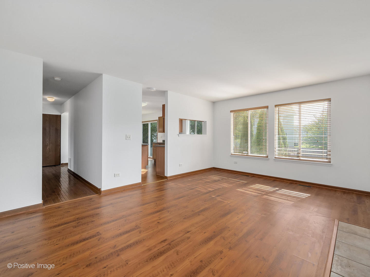 215 Berkeley Drive Bolingbrook, IL 60440 - Photo 15 of 28 a view of empty room with wooden floor and fan