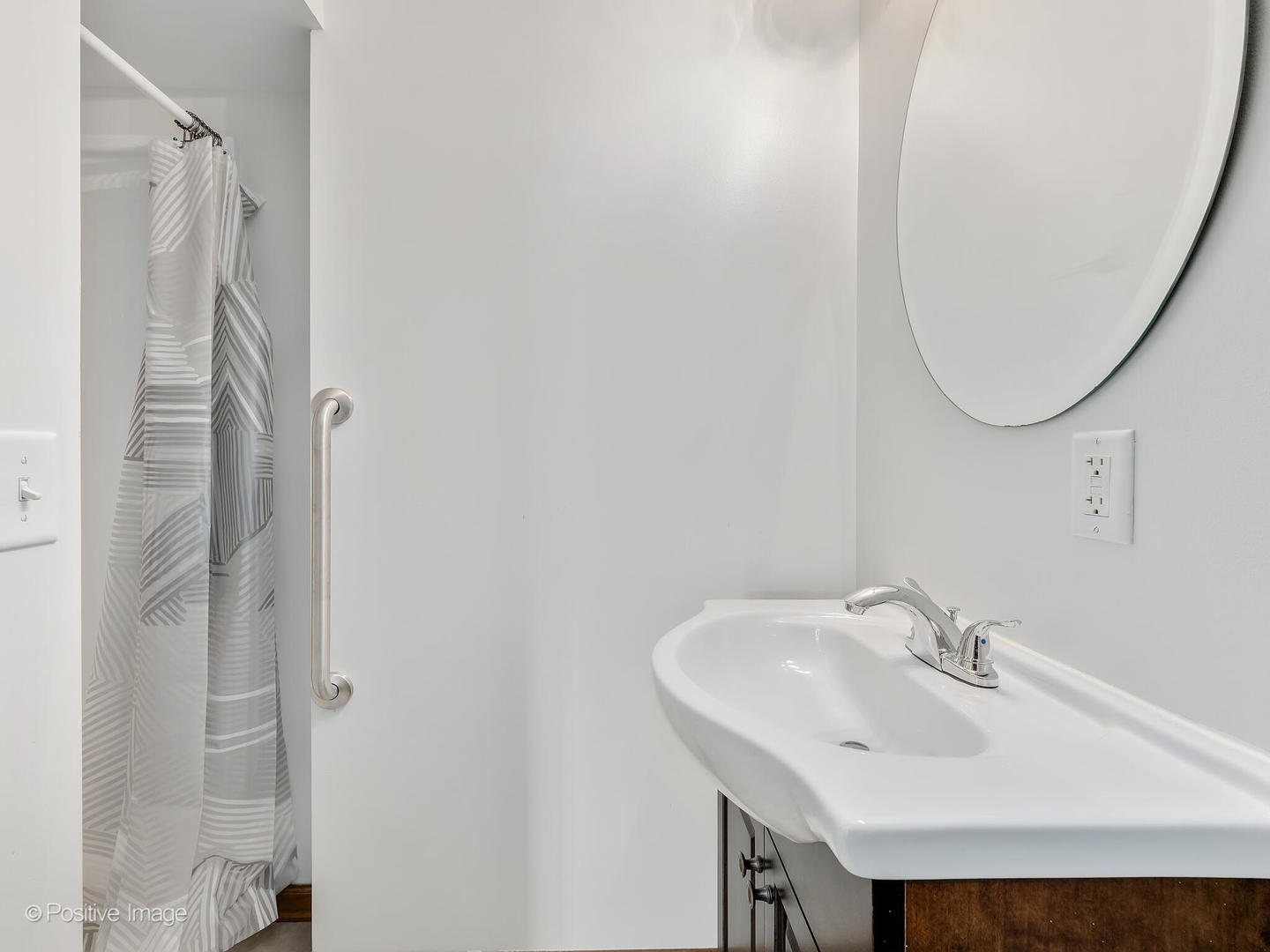 215 Berkeley Drive Bolingbrook, IL 60440 - Photo 16 of 28 a bathroom with a sink and a mirror