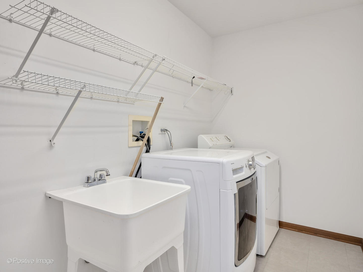 215 Berkeley Drive Bolingbrook, IL 60440 - Photo 17 of 28 a utility room with dryer and washer