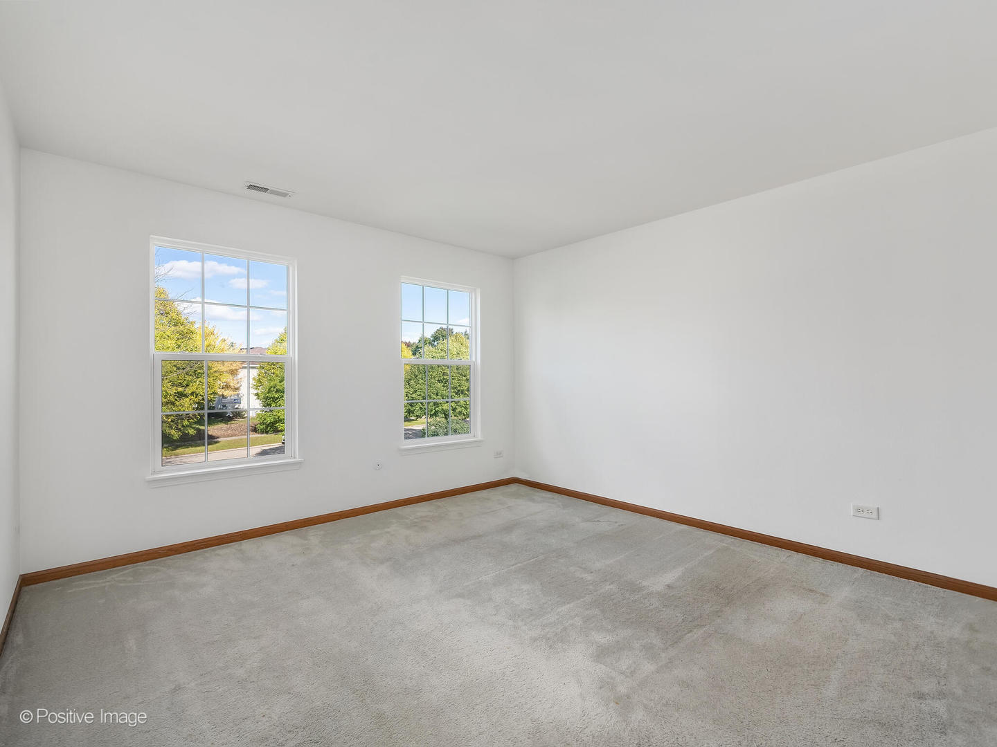 215 Berkeley Drive Bolingbrook, IL 60440 - Photo 21 of 28 an empty room with windows