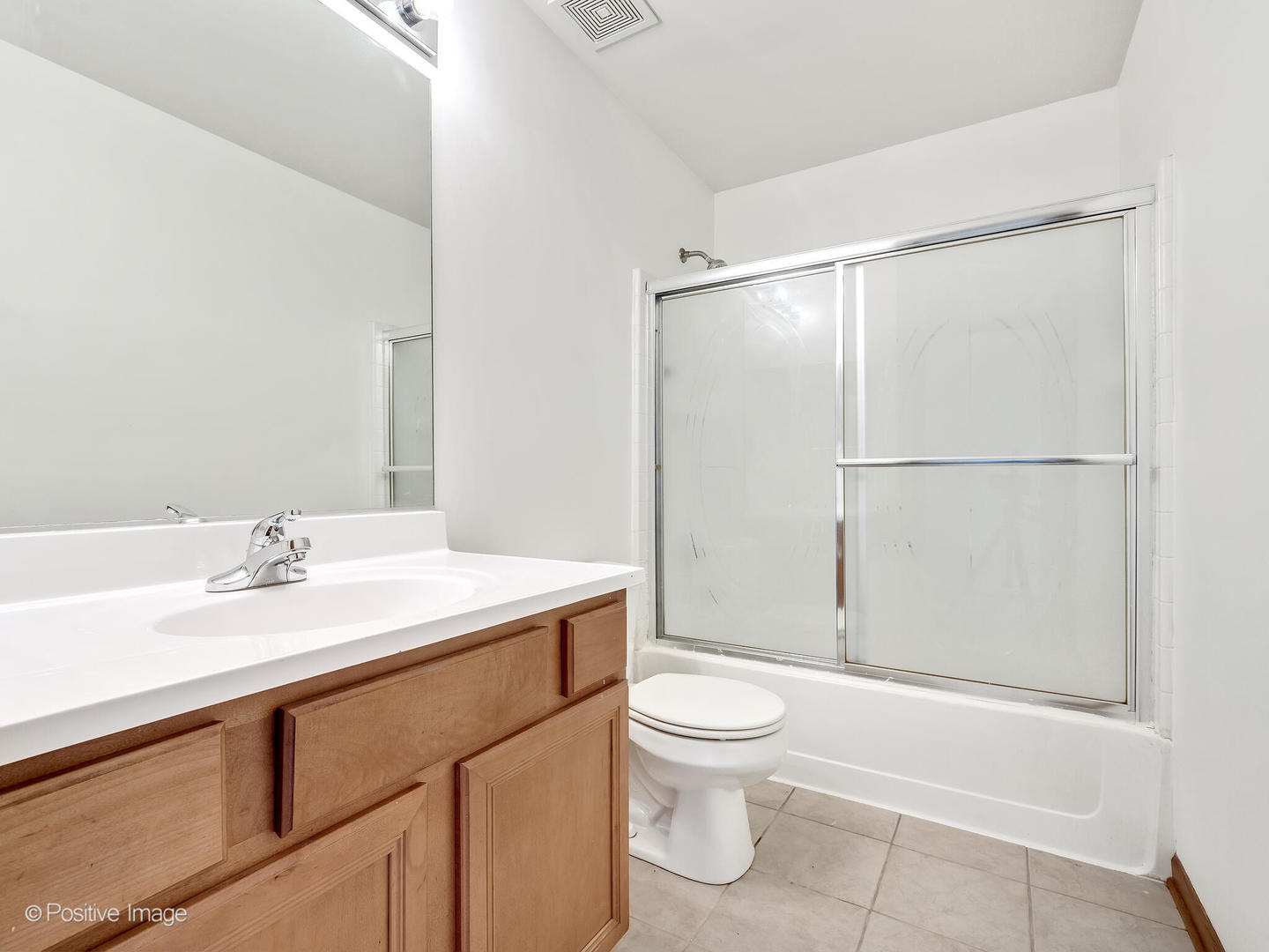 215 Berkeley Drive Bolingbrook, IL 60440 - Photo 23 of 28 a bathroom with a sink a toilet and shower