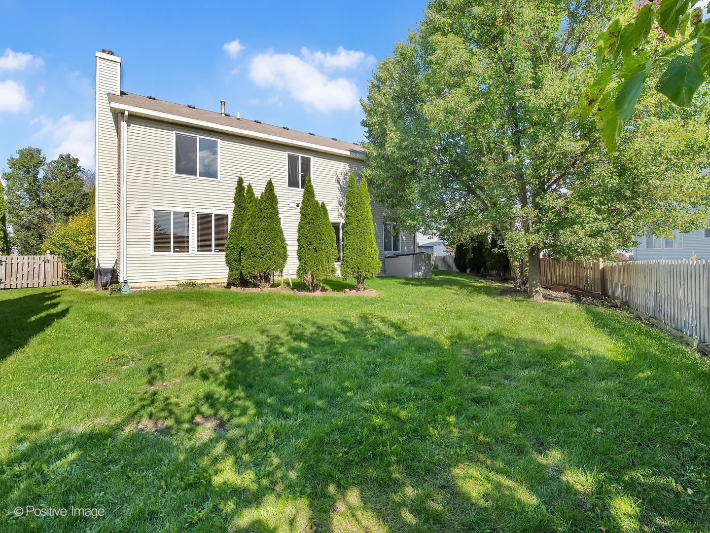 215 Berkeley Drive Bolingbrook, IL 60440 - Photo 25 of 28 a view of a house with yard and a garden