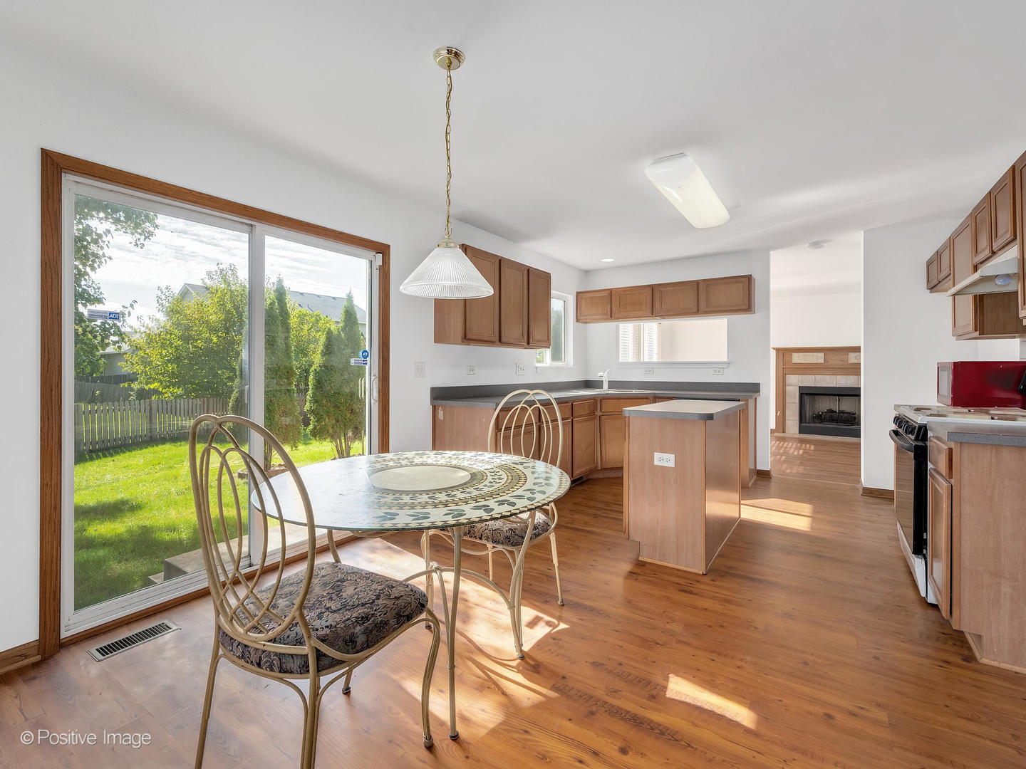 215 Berkeley Drive Bolingbrook, IL 60440 - Photo 8 of 28 a view of a dining room with furniture window and wooden floor