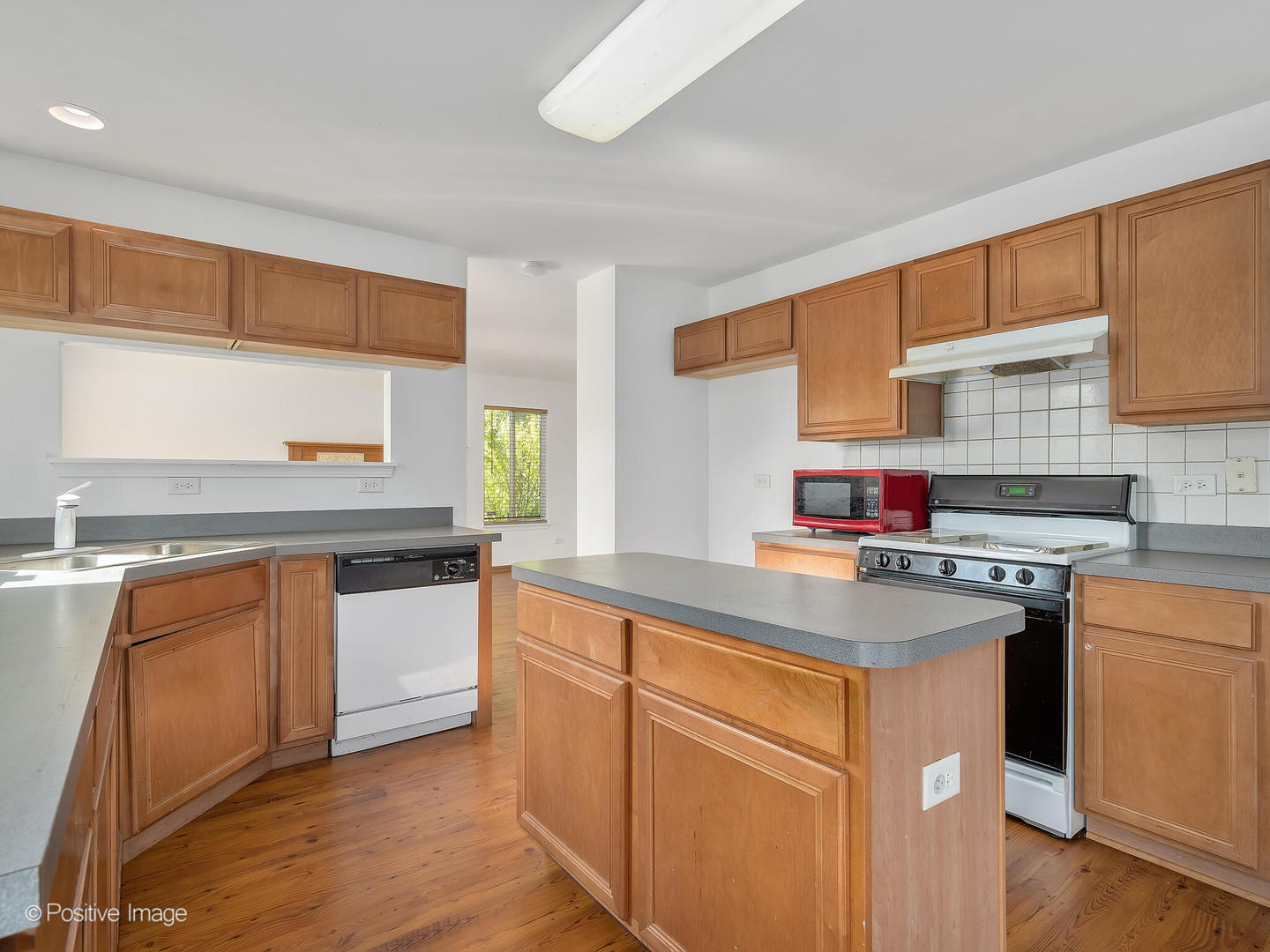 215 Berkeley Drive Bolingbrook, IL 60440 - Photo 9 of 28 a kitchen with stainless steel appliances granite countertop a stove a sink dishwasher and a refrigerator