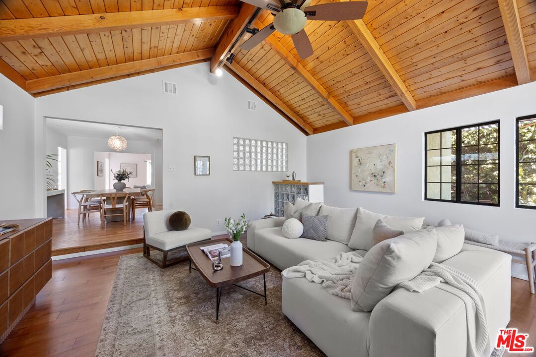 4908 Ramsdell Avenue La Crescenta, CA 91214 - Photo 15 of 29 a living room with furniture and wooden floor