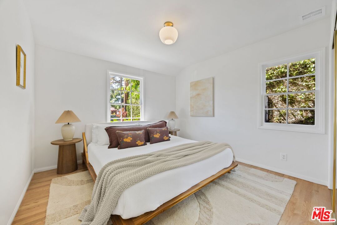 4908 Ramsdell Avenue La Crescenta, CA 91214 - Photo 18 of 29 a bedroom with a bed and a window