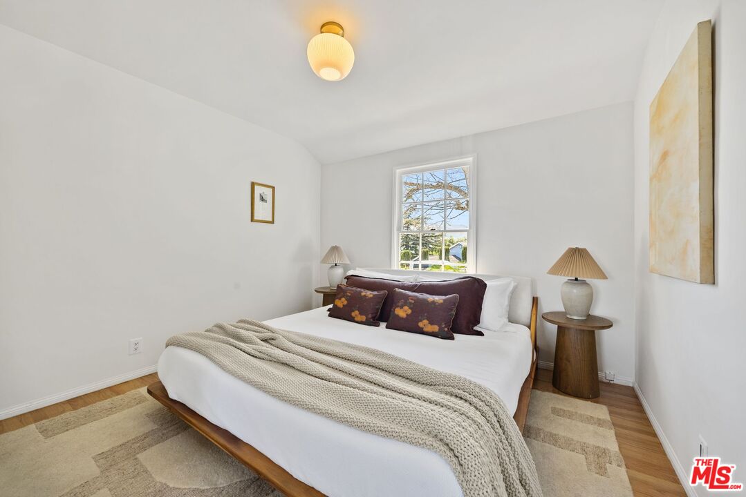 4908 Ramsdell Avenue La Crescenta, CA 91214 - Photo 19 of 29 a bedroom with a bed and a window