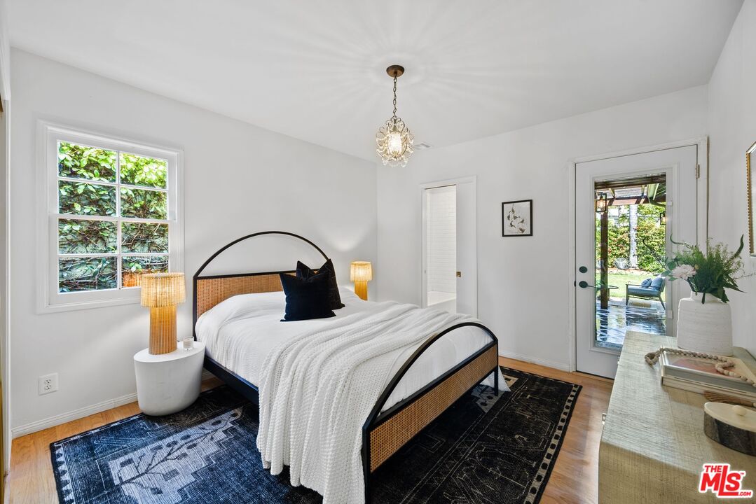 4908 Ramsdell Avenue La Crescenta, CA 91214 - Photo 21 of 29 a bedroom with a bed and a window