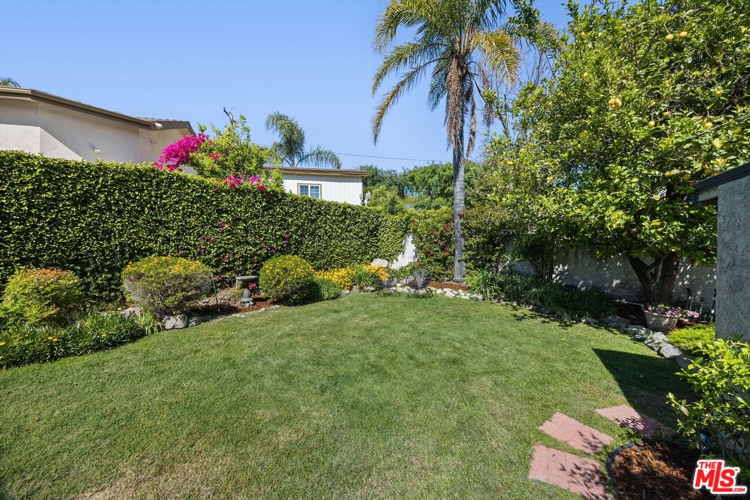 4908 Ramsdell Avenue La Crescenta, CA 91214 - Photo 27 of 29 a front view of a house with a yard and potted plants