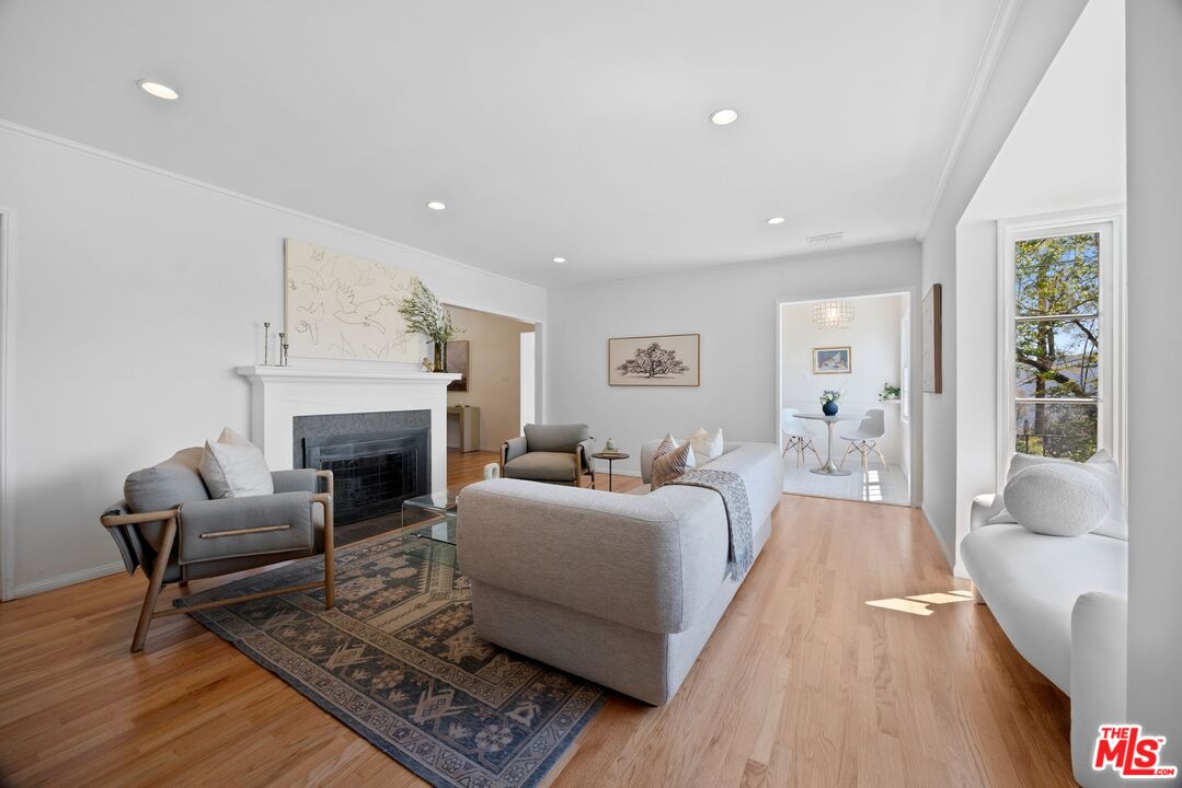 4908 Ramsdell Avenue La Crescenta, CA 91214 - Photo 4 of 29 a living room with furniture and a fireplace