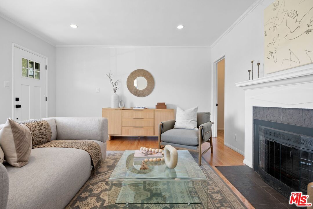 4908 Ramsdell Avenue La Crescenta, CA 91214 - Photo 6 of 29 a living room with furniture and a fireplace