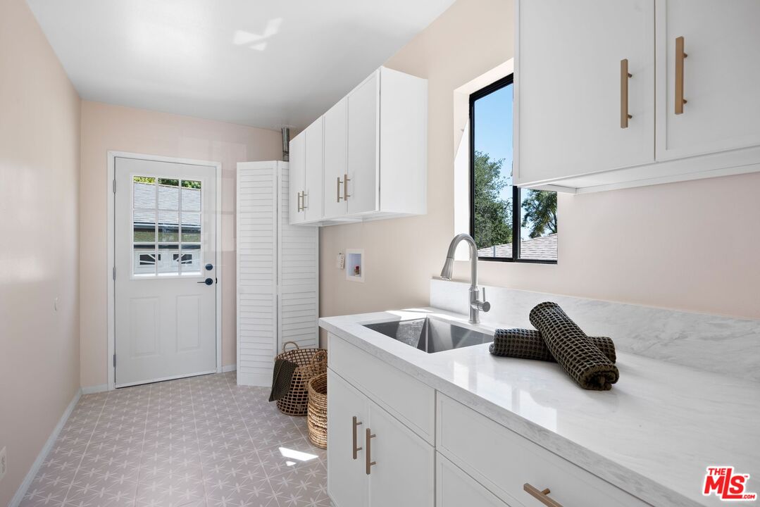 4908 Ramsdell Avenue La Crescenta, CA 91214 - Photo 10 of 29 a kitchen with a sink cabinets and a window