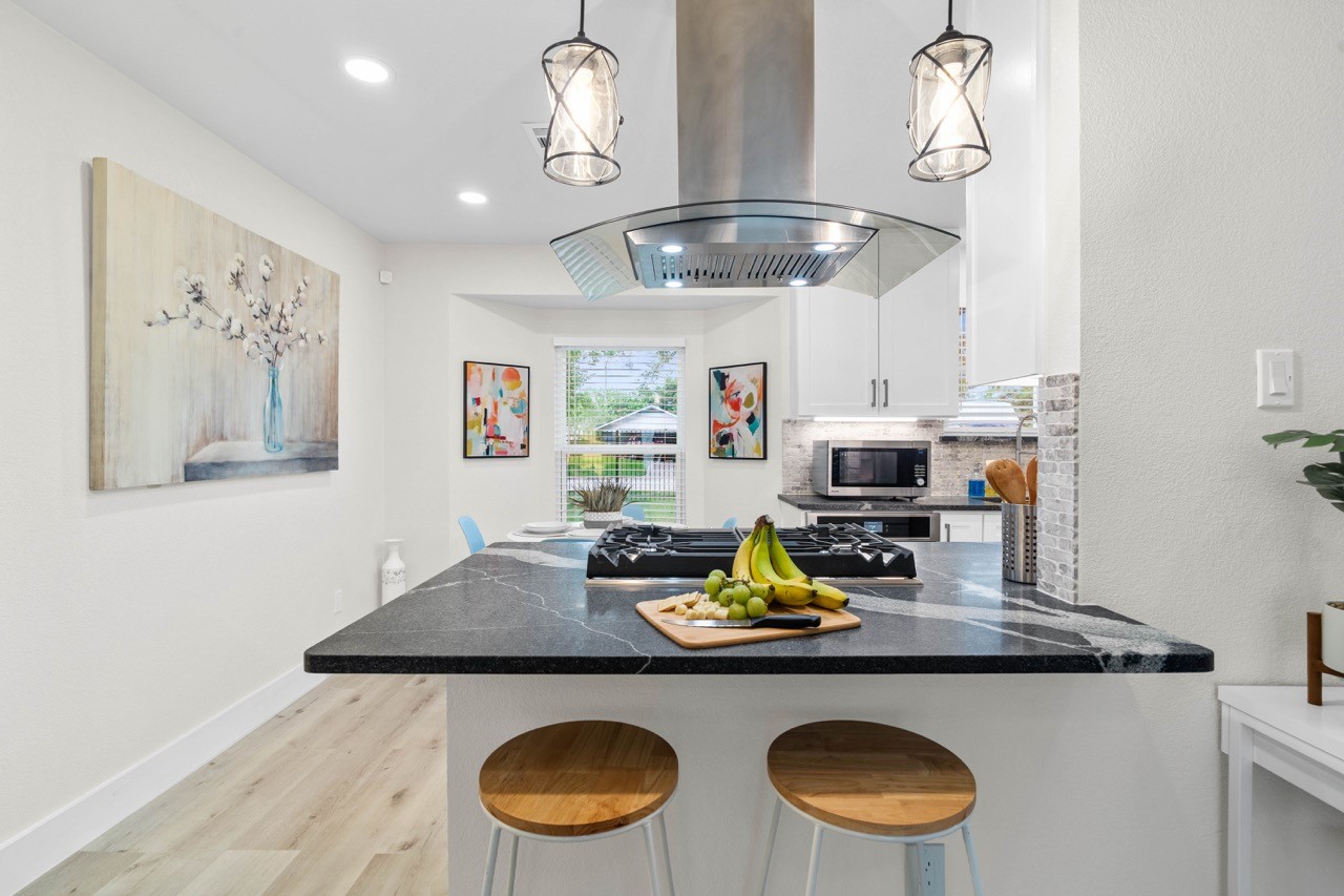 3138 Sunbeam Street Houston, TX 77051 - Photo 16 of 50 Bold countertops and sleek finishes turn this chef-inspired kitchen into the true centerpiece of the home.