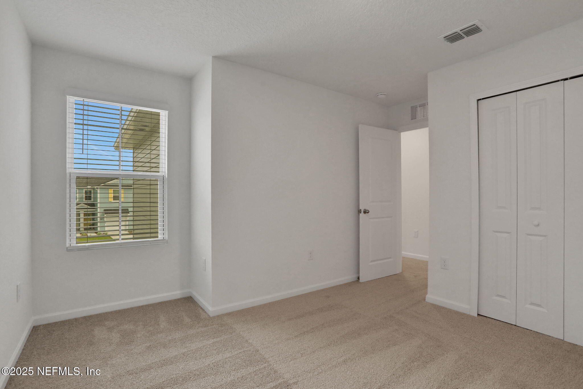 3761 Athenian Way Middleburg, FL 32068 - Photo 10 of 49 a view of an empty room with a window