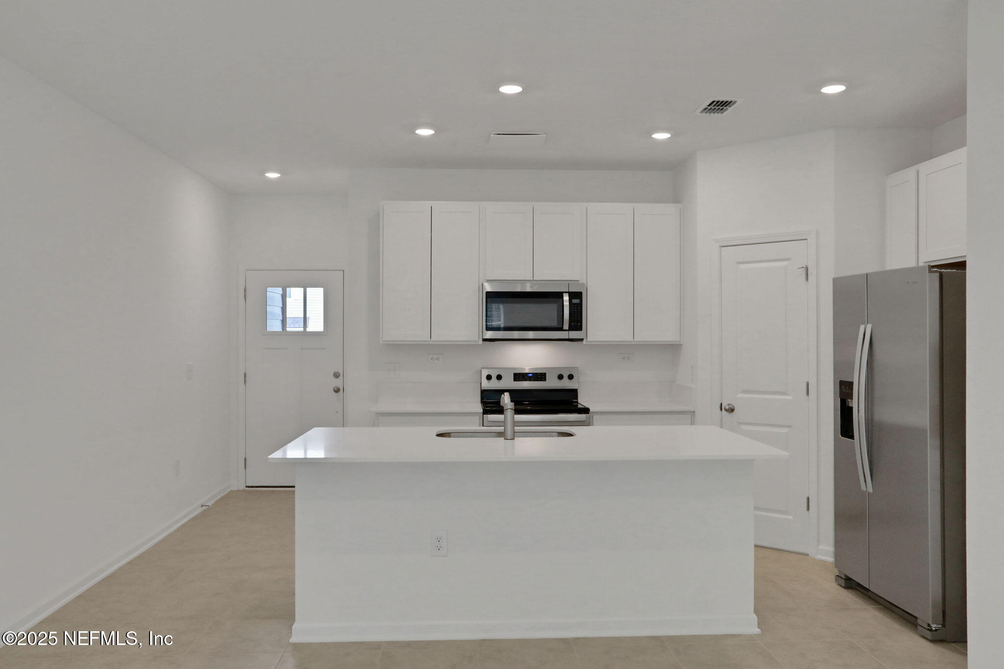 3761 Athenian Way Middleburg, FL 32068 - Photo 30 of 49 a kitchen with stainless steel appliances a refrigerator stove microwave and sink